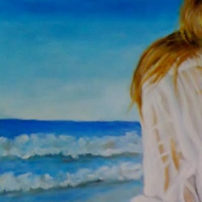 Arrodillada en la playa